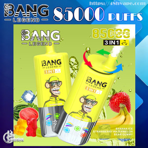 Bright yellow Bang Legend disposable vape advertisement showing two 85,000‑puff 3‑in‑1 devices featuring a grinning cartoon monkey, flavor icons and pictured fruits (banana, strawberry, watermelon) plus gummy bears and ice on a blue‑green promotional background with prominent '85000 puffs' text.