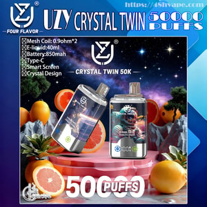 Promotional graphic for the UZY Crystal Twin 50K showing two crystal-design vape devices on a pink pedestal against a starry galaxy background surrounded by grapefruit and oranges, with a feature list (0.9Ω mesh coils, 40ml e-liquid, 850mAh battery, Type‑C, smart screen) and large '50000 PUFFS' text.
