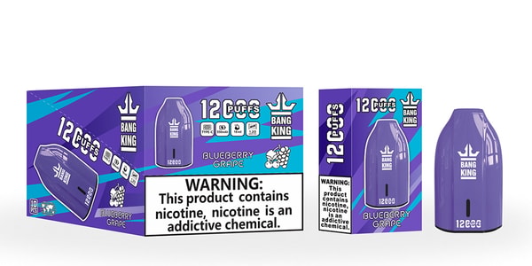 Purple, pod-shaped Bang King disposable vape next to matching boxed packaging labeled “12 puffs” and “Blueberry Grape,” featuring the brand logo and a prominent nicotine warning panel.