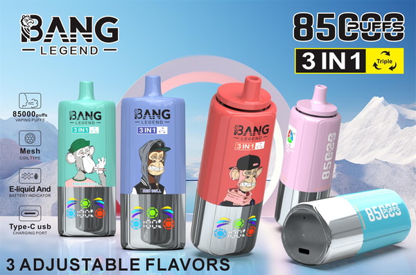 Five colorful Bang Legend 3-in-1 disposable vape devices with cartoon monkey graphics and digital battery indicators, labeled 85,000 puffs and 3 adjustable flavors, displayed on a reflective surface against a mountain sky backdrop.