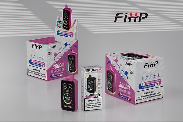Pink FIHP disposable vape device with colorful digital display stands among matching pink-and-white boxes labeled "Double Flavor" and "36000 puffs" (Strawberry Watermelon/Strawberry Mango) on a glossy surface with striped shadow lighting