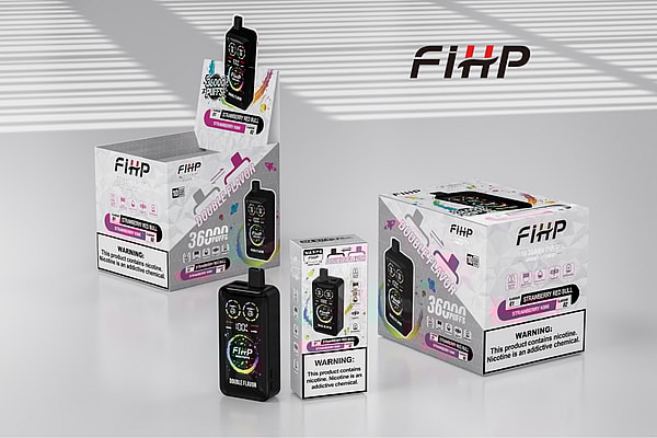 Three FIHP disposable vape products and matching retail boxes arranged on a white tabletop with striped shadow patterns, showing a black pod-style device with a colorful digital display in front and packaging labeled “double flavor,” “36,000 puffs,” flavor names like Strawberry Red Bull, and visible nicotine warning labels.