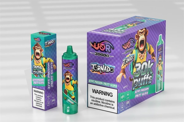 Disposable vape device and two matching purple retail boxes featuring a green-topped pen, bold “30k puffs” branding, a screaming cartoon monkey illustration, “Kiwi Passion Fruit Guava” flavor label, and a visible nicotine warning.