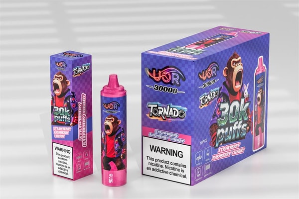 Three pink-and-purple vaping products — a tall rectangular box, a cylindrical disposable vape device, and a larger display box — all branded "Tornado" and "30k puffs" with a shouting cartoon monkey, flavor labeled "strawberry raspberry cherry," and a visible nicotine warning label.