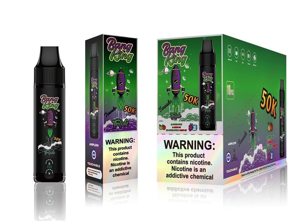 Three Bang King disposable vape products—a black cylindrical device and two matching green-and-purple boxes featuring a cartoon rocket, '50K' label and prominent nicotine warning—displayed on a white background with a faint reflection.