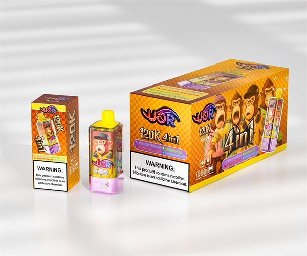 Small rectangular disposable vape with a yellow mouthpiece and an illustrated monkey on its body displayed alongside two matching orange-yellow boxes labeled “120K 4in1” featuring cartoon monkeys and a prominent nicotine warning label.