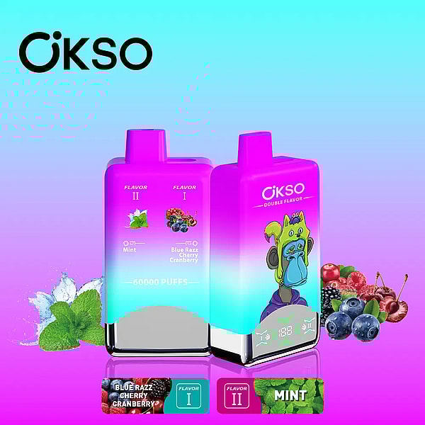 Two gradient pink-to-teal OKSO disposable vape devices—one labeled Blue Razz Cherry Cranberry with '60000 puffs' and flavor icons, the other branded OKSO Double Flavor with a cartoon green monkey—set against a cyan-to-magenta background with mint leaves, blueberries and cherries arranged around them.