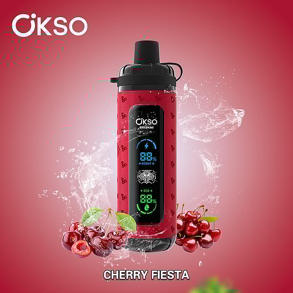 Red OKSO Shishai bottle with black cap and central blue-green digital display, surrounded by fresh cherries and splashing water on a red background labeled Cherry Fiesta