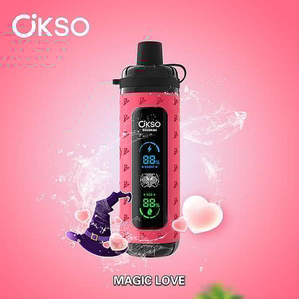 Pink ÖKSO bottle with a black digital display reading 88% and a small logo, shown against a glossy pink background with water splashes, floating hearts and a purple witch hat, captioned MAGIC LOVE beneath.
