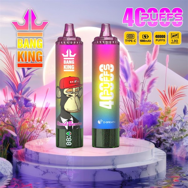 Two rainbow-gradient disposable vape devices labeled Bang King and 40 Puffs stand on a round marble pedestal against a dreamy pastel floral background; the left device shows a cartoon ape wearing a red cap with the flavor name Mixed Berries and a small battery percentage display, while the right displays vertical 40 PUFFS text and a D-Breath logo.