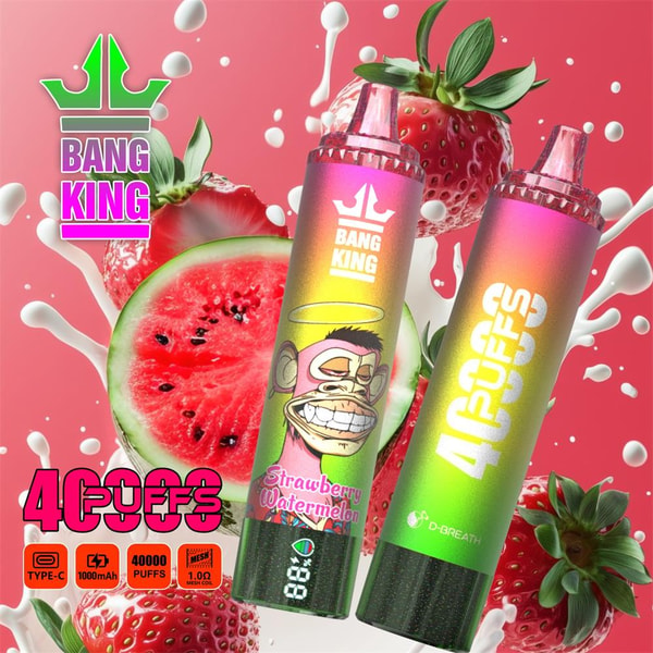 Two rainbow-gradient disposable vape devices branded Bang King—one labeled Strawberry Watermelon with a grinning cartoon monkey and a digital battery readout, the other showing vertical “40 PUFFS” text—set before sliced watermelon and strawberries with white milk-like splashes on a pink background.