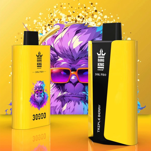 Two bright yellow Bang King 30K Pro vape devices—one showing a black side panel labeled Triple Berry—standing on a reflective surface against a yellow backdrop with paint splatters and a stylized purple bearded ape wearing pink sunglasses.