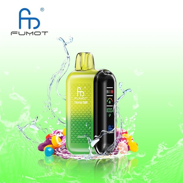 Compact green-to-yellow pod vape with a glossy black front display showing battery and settings, set amid splashing water and colorful round candies, with the FUMOT logo in the top left.