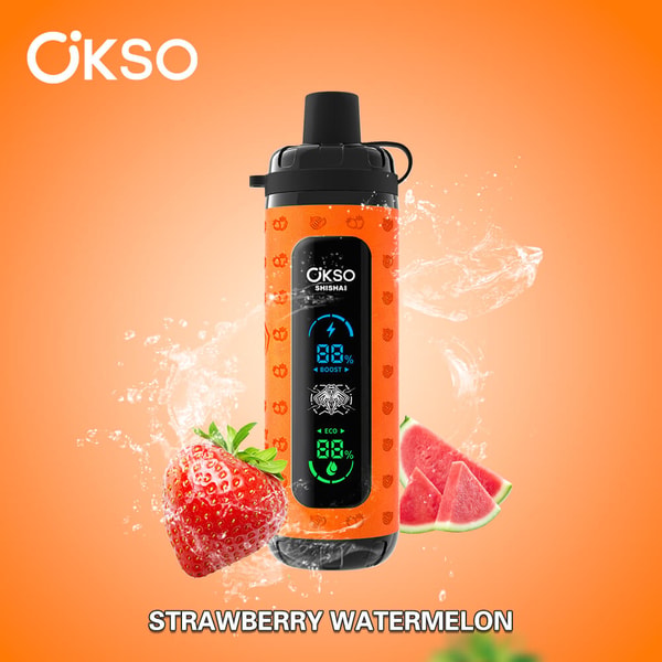 Orange ÖKSO portable shisha device with black cap and vertical digital display, water splashing behind it and a strawberry and watermelon slices in front on an orange background labeled Strawberry Watermelon