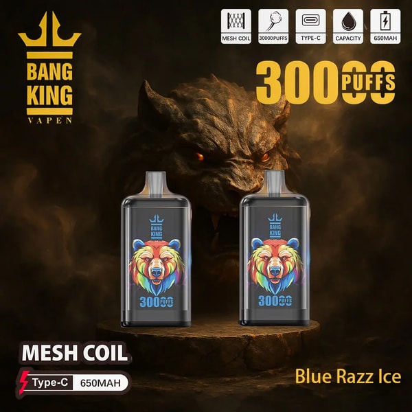 Two black Bang King disposable vape devices with colorful rainbow bear artwork and '300 puffs' labels sit on a stone pedestal against a smoky dark background dominated by a menacing horned creature with glowing eyes; crown brand logo at top left, product icons (mesh coil, Type-C, 650mAh) across the top, and 'Blue Razz Ice' flavor text at bottom right.